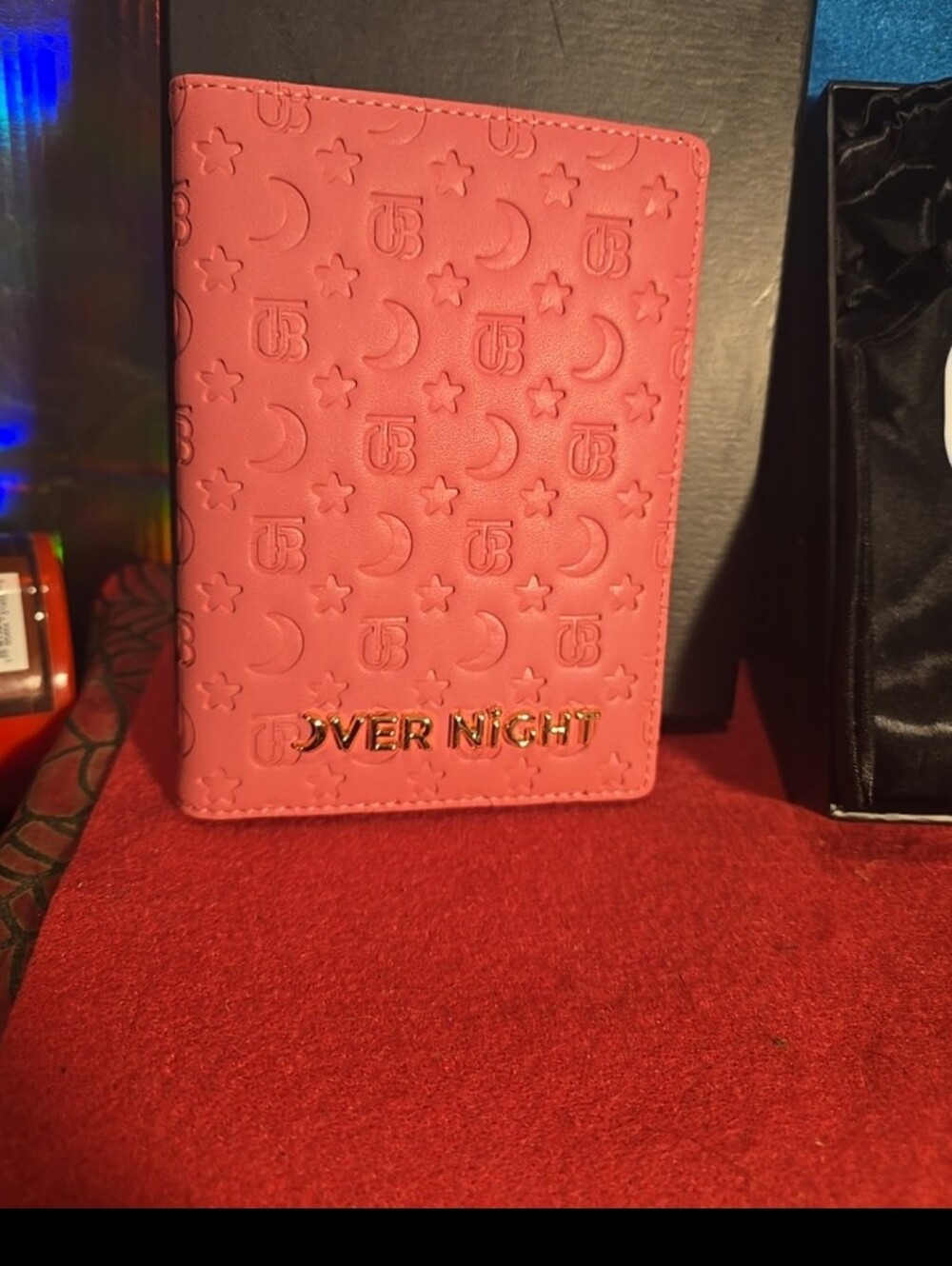 051826 Compact pink passport or travel document holder. Embossed moon, star and